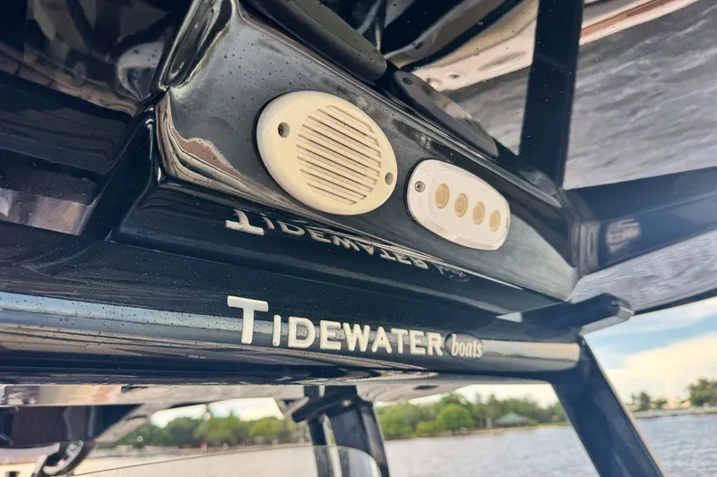 Slide: The Image of Close-up of 2019 Tidewater 320 CC Adventure boat with logo and speaker detail. - 31