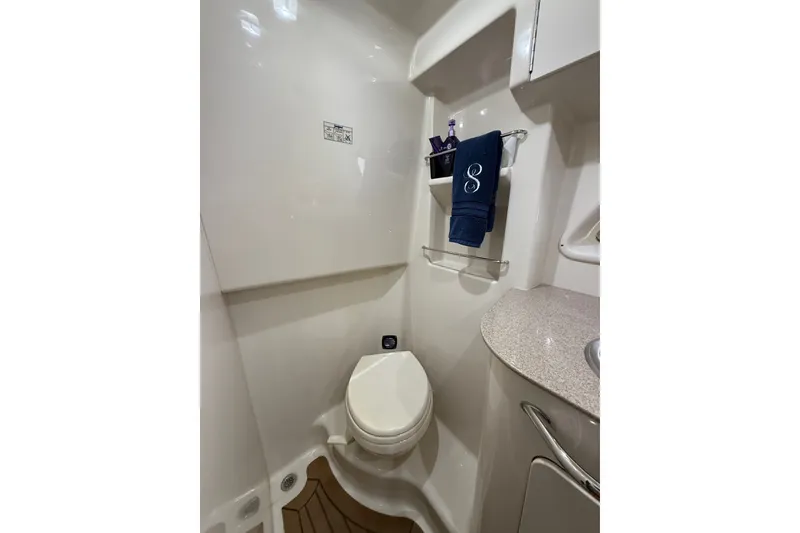Slide: The Image of Bathroom interior of 2007 Sea Ray Sundancer 310 yacht, featuring toilet and countertop. - 29