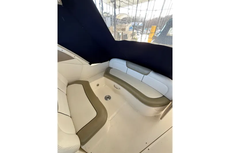 Slide: The Image of Interior seating area of 2007 Sea Ray Sundancer 310 boat with cushioned benches. - 20