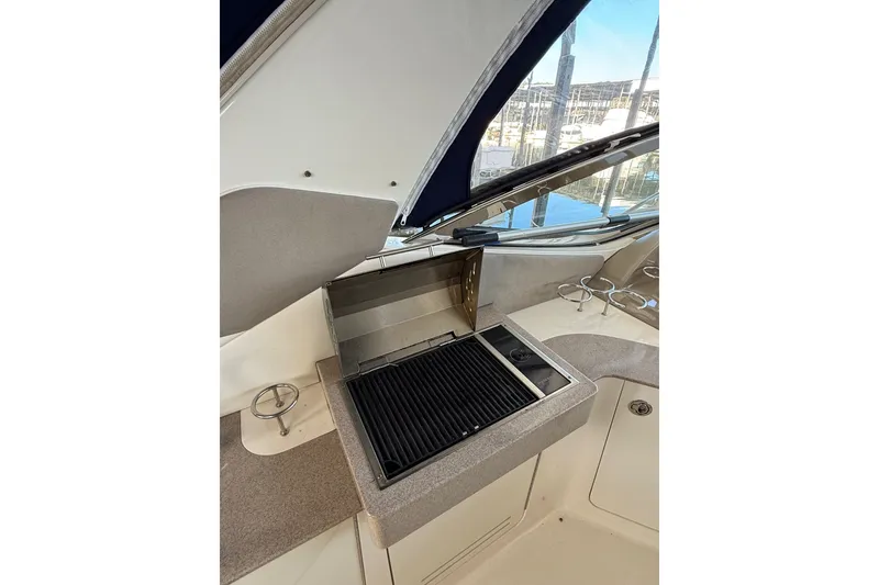 Slide: The Image of 2007 Sea Ray Sundancer 310 boat grill station with countertop and cup holders. - 17