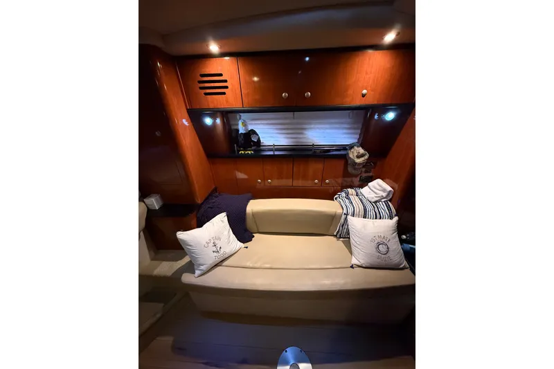 Slide: The Image of Interior of 2007 Sea Ray Sundancer 310 yacht with cozy seating and decorative pillows. - 22