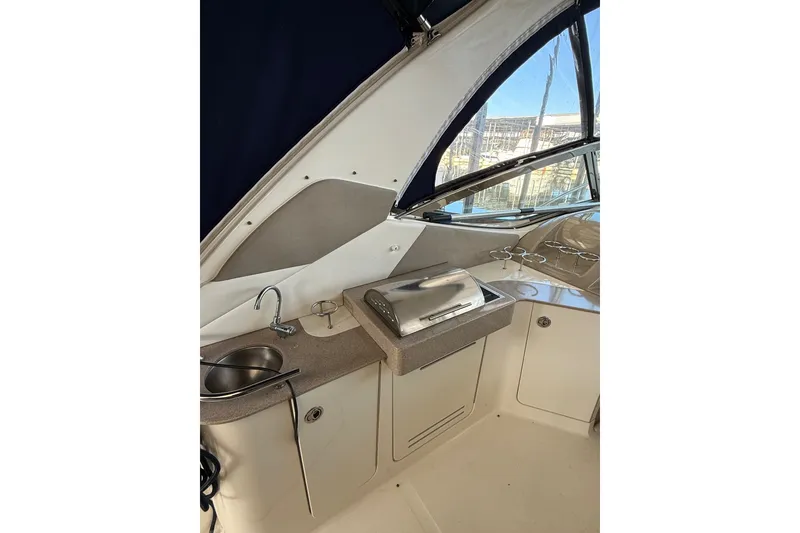 Slide: The Image of 2007 Sea Ray Sundancer 310 boat interior with sink and grill station. - 16