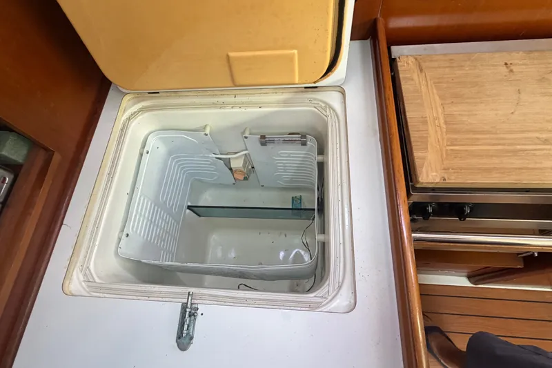 Slide: The Image of Open refrigerator compartment in 2003 Beneteau Oceanis 393 yacht galley. - 10