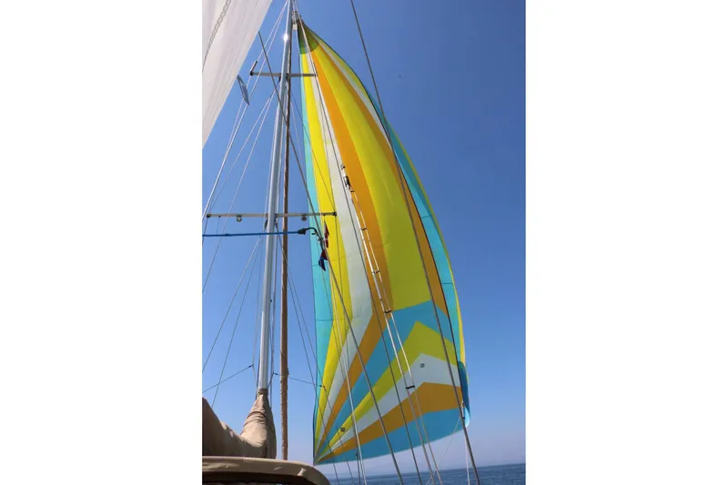 Slide: The Image of Colorful sail on a 1982 Passport Hoyt 45 yacht against clear blue sky. - 7