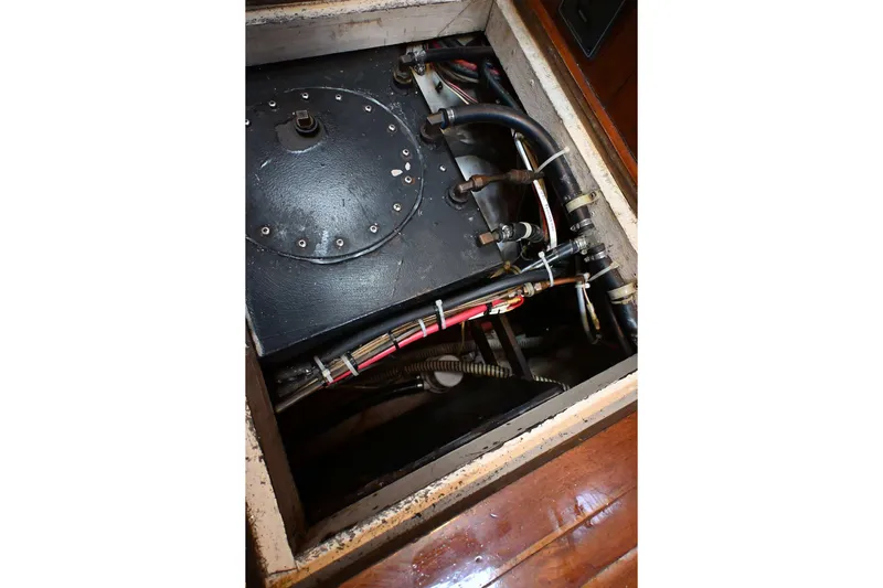 Slide: The Image of Engine compartment of a 1982 Passport / Hoyt 45 sailboat, showing mechanical components and wiring. - 91