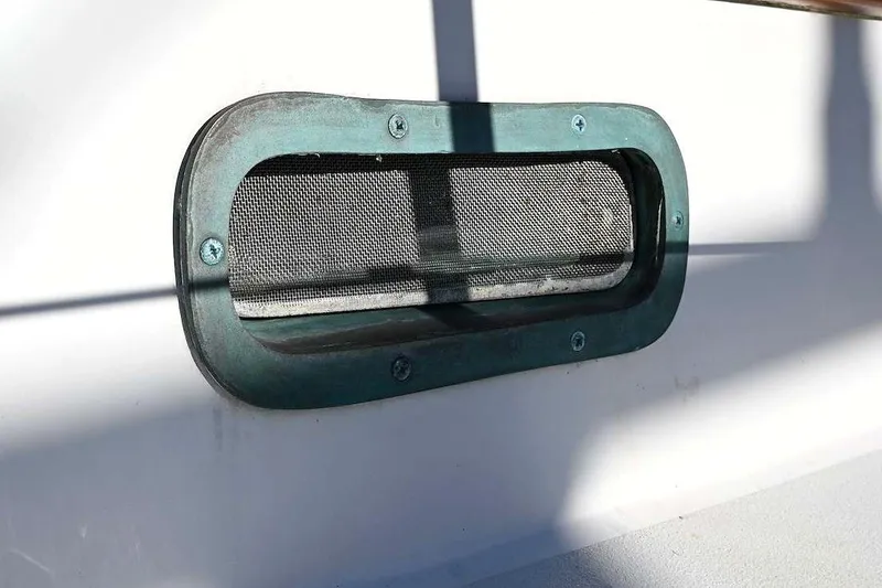 Slide: The Image of Close-up of a 1982 Passport / Hoyt 45 boat vent with mesh screen. - 44