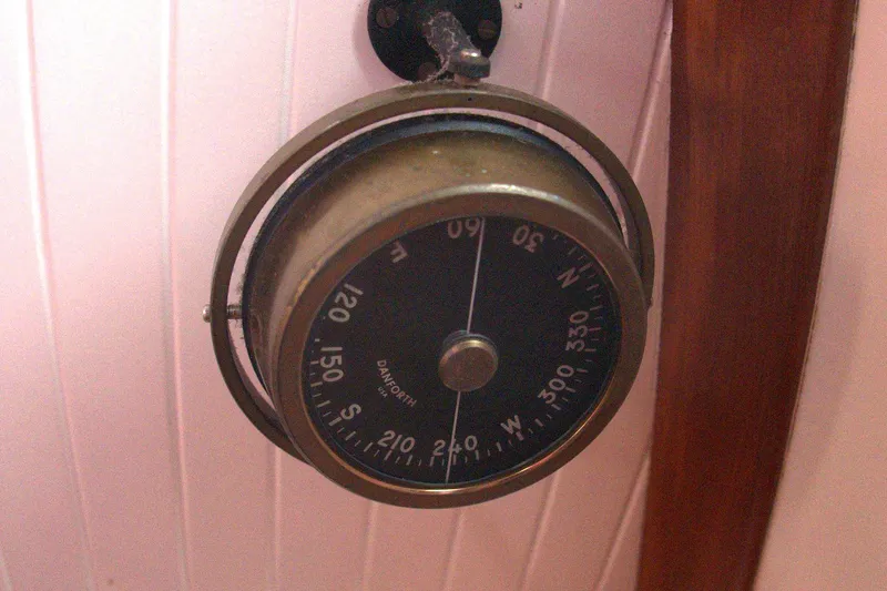 Slide: The Image of Vintage 1982 Danforth compass on a Passport/Hoyt model 45 boat, mounted on a wooden panel. - 82