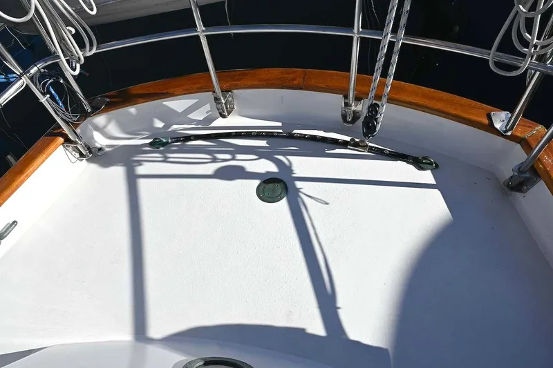 Slide: The Image of Cockpit of 1982 Passport Hoyt 45 sailboat with wooden trim and rigging. - 16