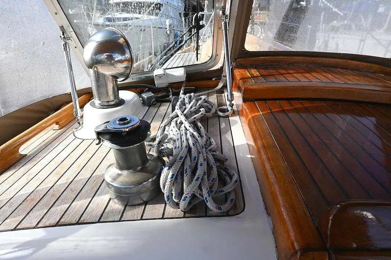 Slide: The Image of Deck of 1982 Passport Hoyt 45 sailboat with winch and coiled rope. - 21