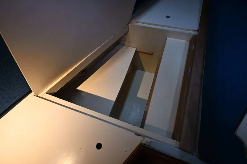 Slide: The Image of Open storage compartment in a 1982 Passport Hoyt 45 boat interior. - 75