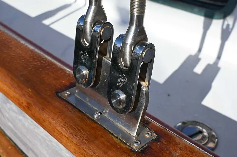 Slide: The Image of Stainless steel rigging hardware on a 1982 Passport Hoyt 45 sailboat deck. - 41