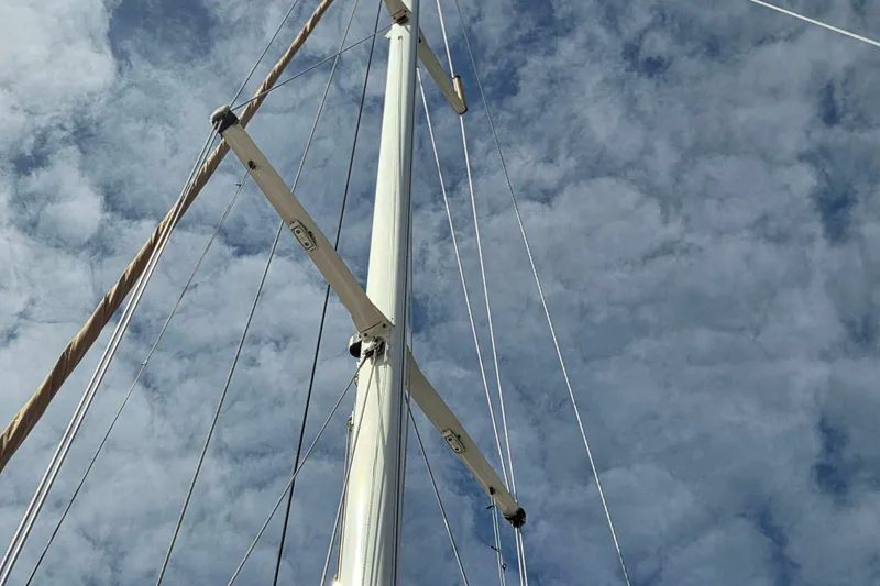 Slide: The Image of Sailboat mast against cloudy sky, Passport Hoyt 45, 1982 model. - 10