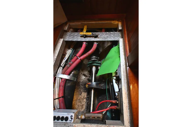 Slide: The Image of Engine compartment of a 1982 Passport / Hoyt 45 sailboat with visible cables and components. - 97