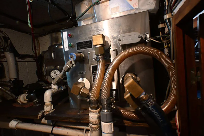 Slide: The Image of Engine room of a 1982 Passport / Hoyt 45 sailboat with mechanical components. - 96