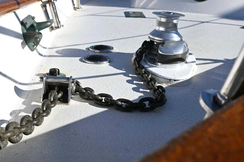 Slide: The Image of Anchor chain and winch on a 1982 Passport / Hoyt 45 sailboat deck. - 39