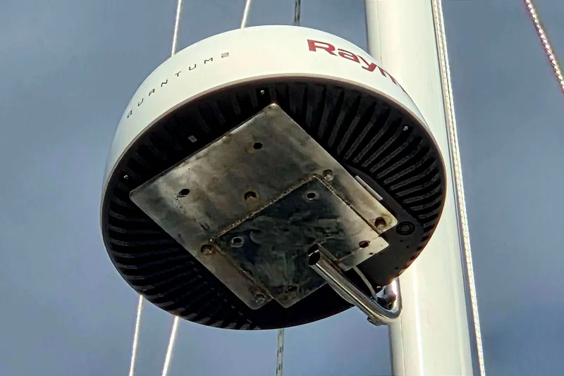 Slide: The Image of Radar dome on a 1982 Passport Hoyt 45 sailboat mast against a clear sky. - 13
