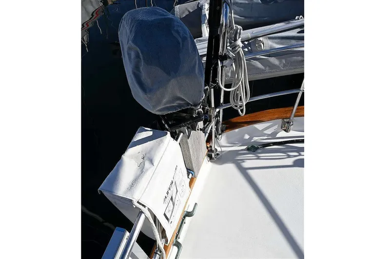 Slide: The Image of Sailboat deck detail with covered equipment, ropes, and railing, Passport Hoyt 45, 1982 model. - 22