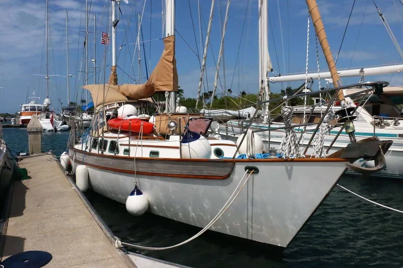 Slide: The Image of Sailboat docked at marina, Passport Hoyt 45 model, 1982, with nautical equipment. - 6