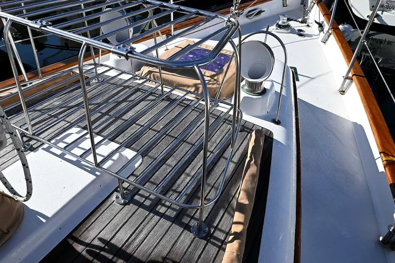 Slide: The Image of Deck of 1982 Passport Hoyt 45 sailboat with stainless steel railing and wooden accents. - 33