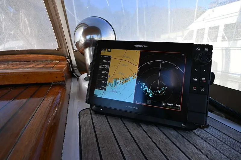 Slide: The Image of Raymarine navigation system on a 1982 Passport / Hoyt 45 yacht, displaying radar and map. - 18