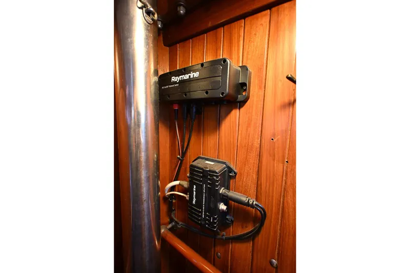 Slide: The Image of Raymarine equipment installed on wooden panel in 1982 Passport / Hoyt model 45. - 87