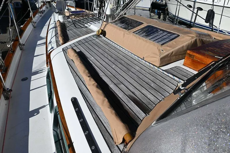 Slide: The Image of Deck of a 1982 Passport Hoyt 45 sailboat with wooden and canvas details. - 23