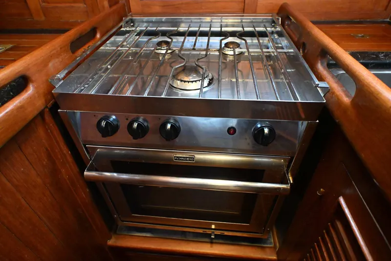 Slide: The Image of Stainless steel stove and oven in a 1982 Passport Hoyt 45 yacht kitchen. - 67