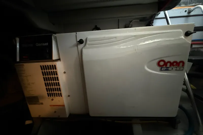 Slide: The Image of Onan marine generator in a 2007 Meridian 411 Sedan yacht engine room. - 23