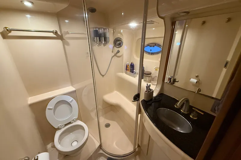 Slide: The Image of Luxurious bathroom in a 2007 Meridian 411 Sedan yacht with shower and sink. - 18