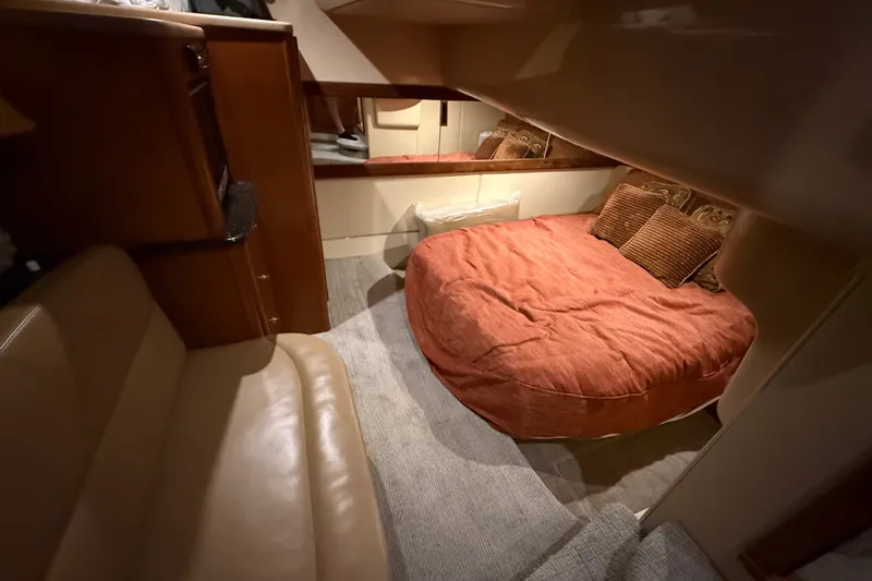 Slide: The Image of Cozy cabin interior of 2007 Meridian 411 Sedan with plush bedding and seating. - 13