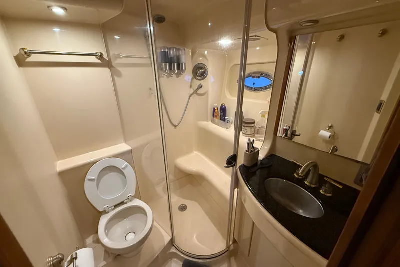 Slide: The Image of Luxurious bathroom in a 2007 Meridian 411 Sedan yacht, featuring modern amenities and sleek design. - 16