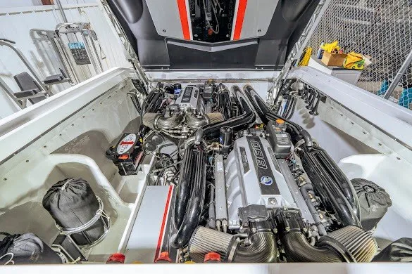 Slide: The Image of Engine compartment of a 2018 Cigarette 42X boat, showcasing powerful dual engines. - 33