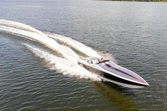 Slide: The Image of 2018 Cigarette 42X speedboat cruising on open water, leaving a trail of white wake. - 6