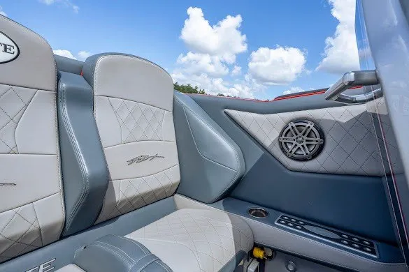 Slide: The Image of Interior of 2018 Cigarette 42X boat with luxurious seating and speaker detail. - 29
