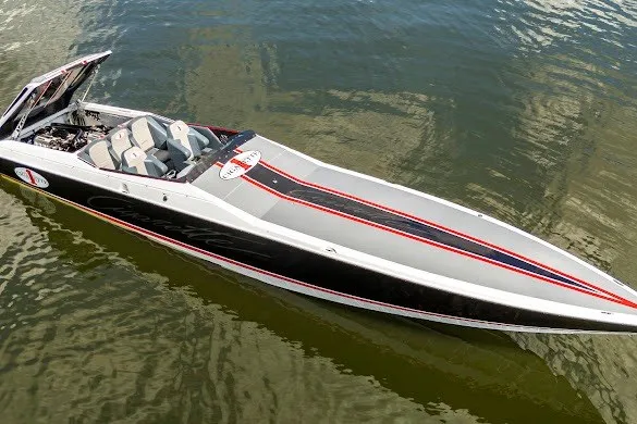 Slide: The Image of 2018 Cigarette 42X speedboat on water, sleek design with red and black accents. - 3