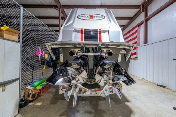 Slide: The Image of 2018 Cigarette 42X boat in storage, showcasing powerful dual propellers and sleek design. - 40
