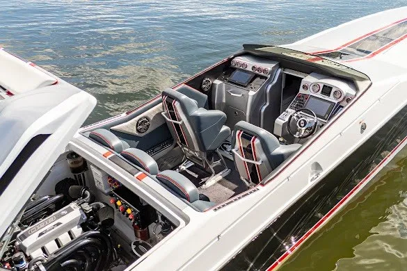 Slide: The Image of 2018 Cigarette 42X speedboat interior with advanced controls and seating on water. - 11