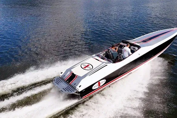 Slide: The Image of 2018 Cigarette 42X speedboat cruising on open water, showcasing sleek design and powerful performance. - 4
