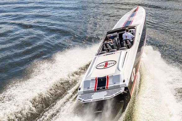 Slide: The Image of 2018 Cigarette 42X speedboat cruising on water, showcasing sleek design and powerful performance. - 9