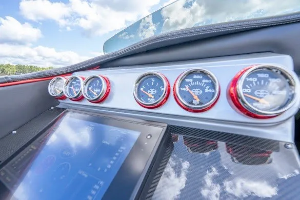 Slide: The Image of Dashboard of 2018 Cigarette 42X boat with multiple gauges and touchscreen display. - 24