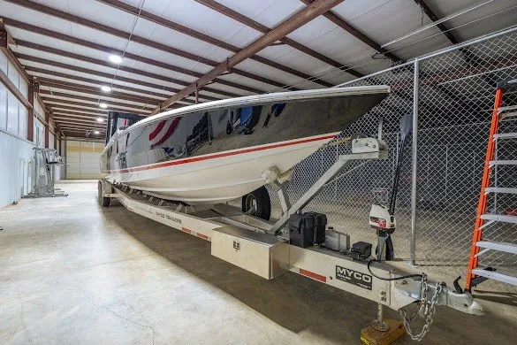 Slide: The Image of 2018 Cigarette 42X boat on trailer in storage facility. - 41