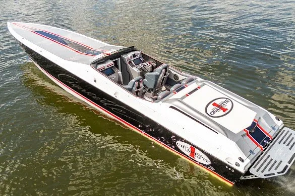 Slide: The Image of 2018 Cigarette 42X speedboat on water, showcasing sleek design and branding. - 2
