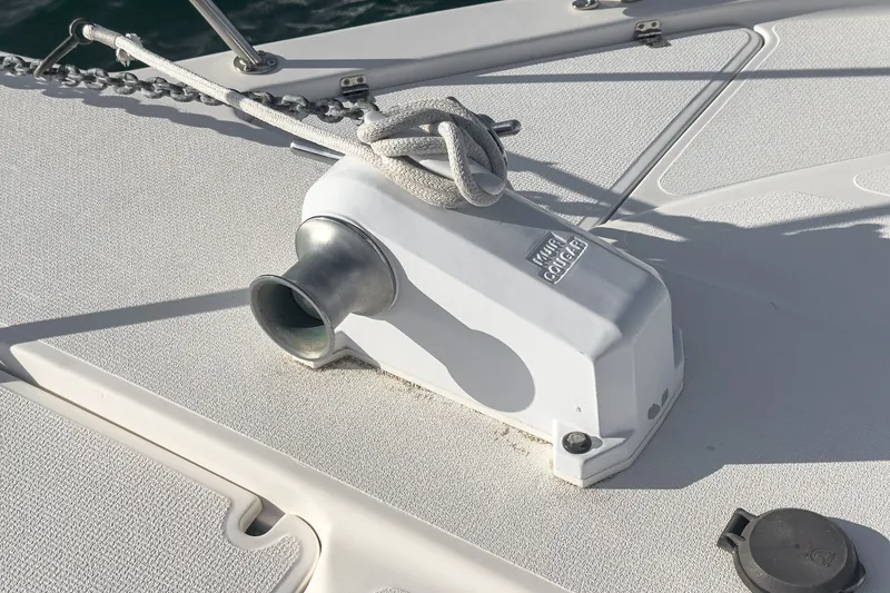 Slide: The Image of Anchor winch on 1998 Riviera 34 Convertible boat deck. - 54