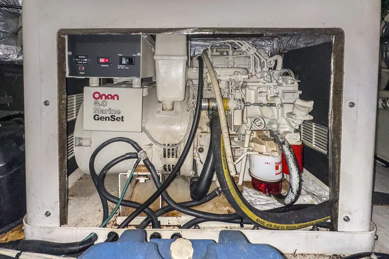 Slide: The Image of Onan 8.0 Marine GenSet in 1998 Riviera 34 Convertible engine compartment. - 52
