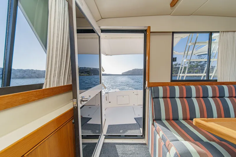 Slide: The Image of Interior view of 1998 Riviera 34 Convertible yacht with ocean backdrop. - 23