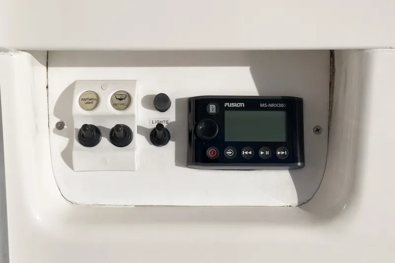 Slide: The Image of Control panel of a 1998 Riviera 34 Convertible boat with Fusion MS-NRX300. - 19