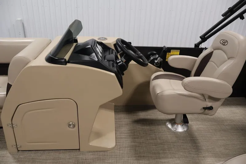 Slide: The Image of 2027 Bentley Pontoons 200 CRUISE XL helm with beige captain's chair and dashboard. - 29