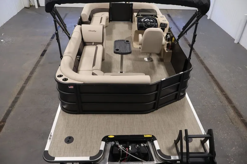 Slide: The Image of 2027 Bentley Pontoons 200 CRUISE XL interior with beige seating and modern helm. - 16