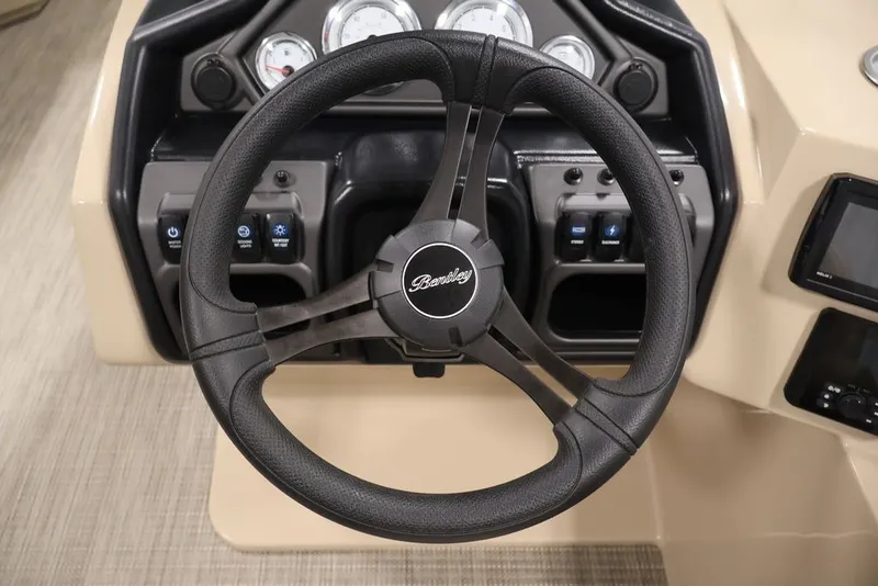 Slide: The Image of Steering wheel of 2027 Bentley Pontoons 200 CRUISE XL with dashboard controls. - 14