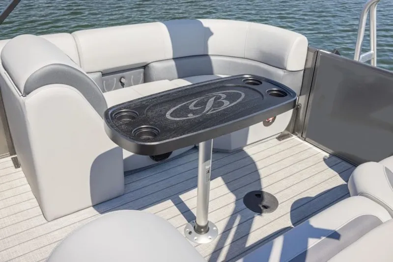 Slide: The Image of 2027 Bentley Pontoons 200 CRUISE XL interior with seating and table on water. - 34